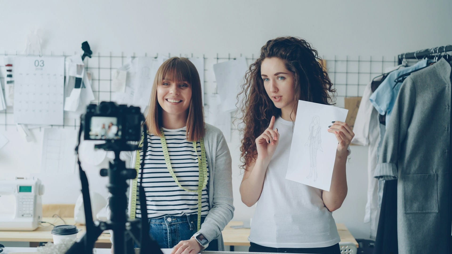 Two social media influencers recording a video in a creative studio